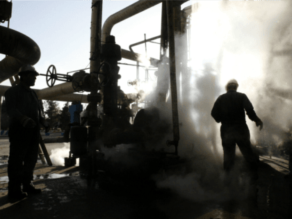 FILE - In this Nov. 17, 2007 file photo, a worker repairs a part of a unit of the Tehran oil refinery, in Tehran, Iran. A series of fires at Iranian petrochemical plants and facilities have raised suspicions about hacking potentially playing a role in the blazes. Iran officially insists …