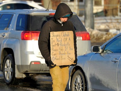 PORTLAND, ME - JANUARY 9: Dana Burnell, a panhandler walking the median strip at the corner of Franklin and Somerset Street, said he read about the possibility of being banned from the medians and said it would severely hurt the homeless who depend on getting money to survive. Recently kicked …