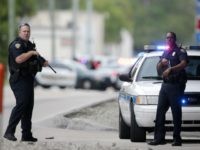 police florida Police officers stand on the perimeter road along the Fort Lauderdale-Hollywood International Airport after a shooter opened fire inside a terminal of the airport, killing several people and wounding others before being taken into custody, Friday, Jan. 6, 2017, in Fort Lauderdale, Fla. (AP Photo/Lynne Sladky)
