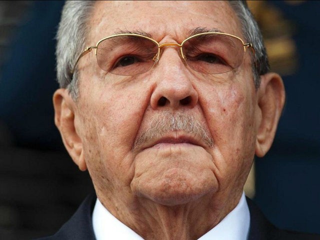 Cuba's President Raul Castro listens to the playing of national hymns during his welcome c