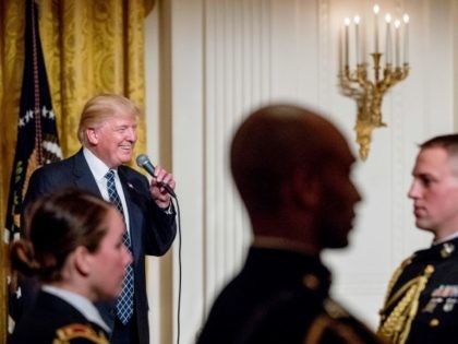 President Donald Trump speaks at a reception for Senators and their spouses in the East Ro