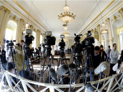 TV cameras are set up by journalists before the annoucement of the 2015 Nobel Prize in Lit