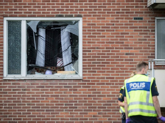 Forensic police investigates on August 22, 2016 an area in Gothenburg, where an explosion demolished an apartment the night before. An eight-year-old boy was killed Monday night when a grenade was thrown into the apartment in Sweden where he was sleeping, police said, adding he was likely the victim of …