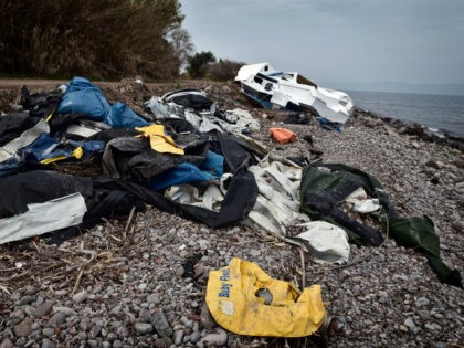 The wreckage of a boat and life jackets used by refugees lie on a beach near Skala Sykamia