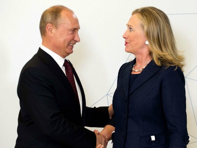 US Secretary of State Hillary Clinton (R) shakes hands with Russian President Vladimir Putin during the arrival ceremony for the Asian-Pacific Economic Cooperation (APEC) Summit in Vladivostok on September 8, 2012. AFP PHOTO/POOL/Jim WATSON