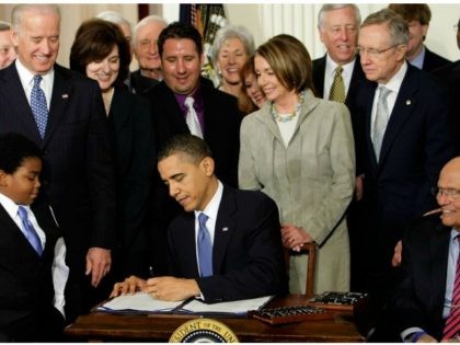 FILE - In this March 23, 2010, file photo, President Barack Obama signs the health care bi