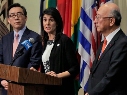 South Korea's Ambassador Cho Tae-yul, left, U.S. Ambassador Nikki Haley, center, and Japan's Ambassador Koro Bessho hold a joint news conference after consultations of the United Nations Security Council, Wednesday, March 8, 2017. (AP Photo/Richard Drew)