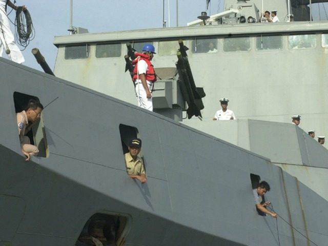 Taiwanese Navy sailors and officers dock the guided-missile frigate Hsi-Ning as it pulls into the port ahead of another frigate and a fuel and munitions supply ship to begin a two-day port call with a crew of 800 sailors and midshipmen in Port-au-Prince, Haiti, on Thursday, May 1, 2003. (AP …