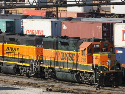 Burlington Northern Santa Fe trains make their way through a rail yard in Cicero, Illinois