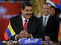 Venezuelan President Nicolas Maduro smiles while giving a speech during the Bolivarian Alliance for the Peoples of Our America (ALBA) summit at the Miraflores presidential palace in Caracas on March 5, 2017. The extraordinary summit is paying homage to late Venezuelan leader Hugo Chavez, on the fourth anniversary of his …