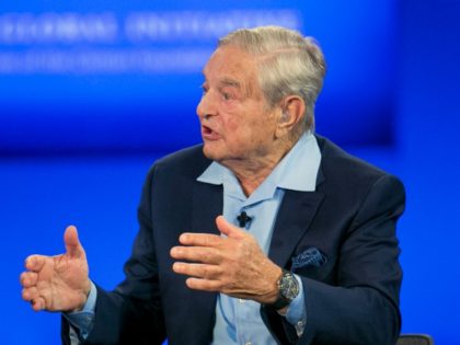 George Soros, Chairman of Soros Fund Management, talks during a television interview for CNN, Sunday, Sept. 27, 2015 at the Clinton Global Initiative in New York. (AP Photo/Mark Lennihan)