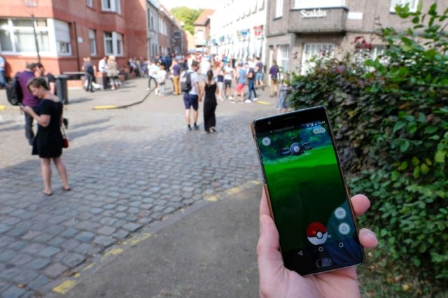 People play at the Pokemon GO augmented reality game on August 20, 2016 in Lillo, a villag