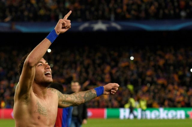 Barcelona's Brazilian forward Neymar celebrates at the end of the Champions League round o