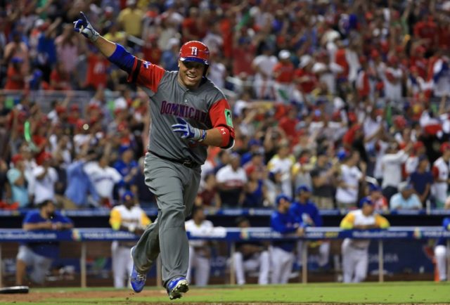 Welington Castillo of the Dominican Republic hits a 2 run single in the 11th inning during