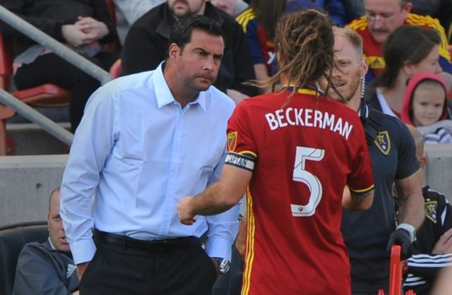 Real Salt Lake head coach Jeff Cassar (L) talks to one of his players during a MLS match i