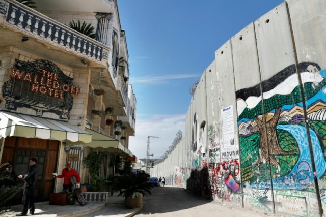 Street artist Banksy opened the Walled-Off Hotel next to Israel's controversial separation