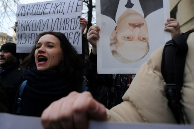 Belarusian opposition supporters take part in a rally against a Soviet-style 'tax on spong