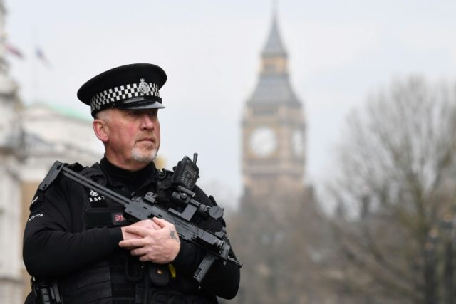 British police stand guard near the Houses of Parliament in London, on March 23, 2017