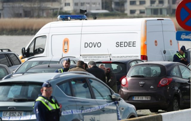 Belgian securuty officials patrol in Antwerp after a man was arrested as he tried to driv