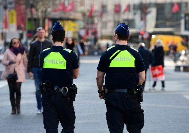 Policemen patrol in the Belgian city of Antwerp on March 23, 2017