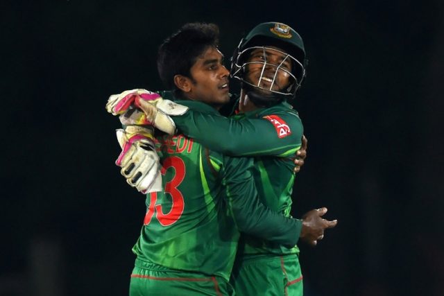 Bangladesh wicketkeeper Mushfiqur Rahim (R) and cricketer Mehedi Hasan celebrate after Rah