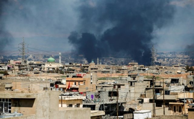 Smoke rises from a neighbourhood in west Mosul, during an offensive by the Iraqi forces to