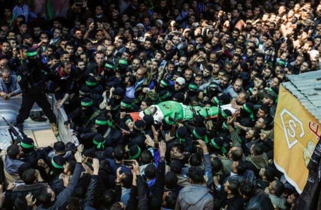 The body of Palestinian Islamist movement Hamas' official Mazen Faqha is carried by member