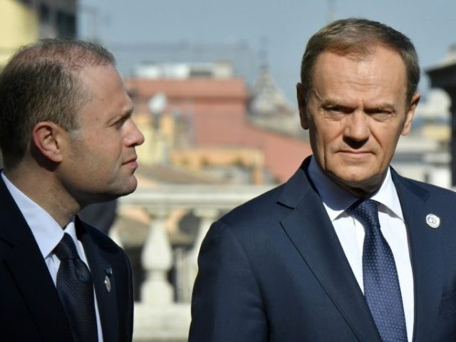 EU President Donald Tusk (R) speaks with Malta's prime minister Joseph Muscat ahead of a s