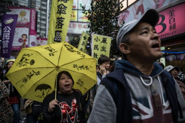 Protesters attend a pro-democracy rally in Hong Kong on March 25, 2017