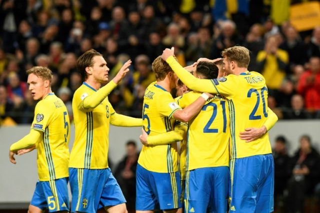 Sweden's midfielder Emil Forsberg celebrates with his teammates after scoring during their