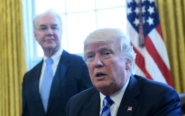 US President Donald Trump, with Health and Human Services Secretary Tom Price (L), speaks