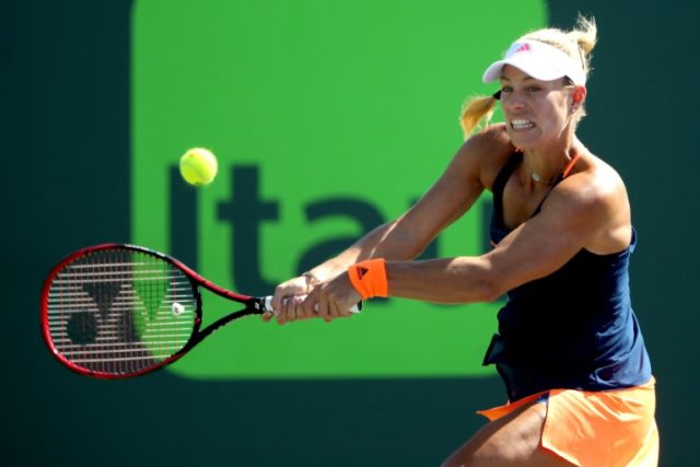 Angelique Kerber of Germany returns a shot to Risa Ozaki of Japan during their Miami Open