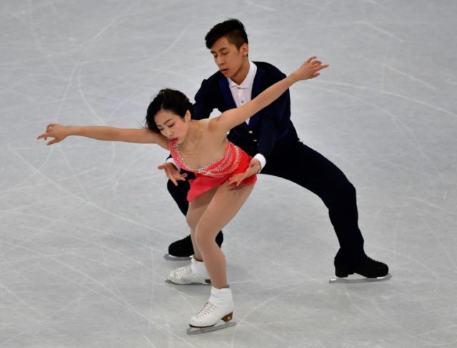 Gold medallists China's Sui Wenjing and Han Cong compete in the pairs free skating event a