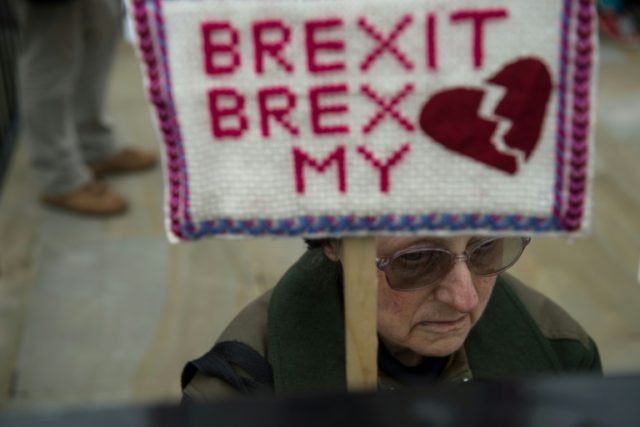 An anti-Brexit protester opposite Downing Street in London after Britain formally began th