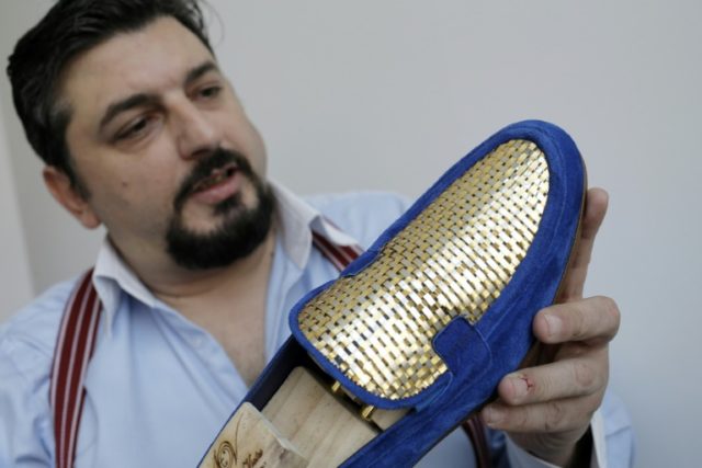 Antonio Vietri's gold shoes sell for up to 30,000 euros a pair