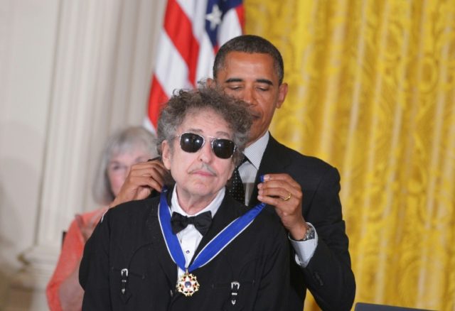 Bob Dylan, whose new album "Triplicate" comes out March 31, is shown here receiving the Pr