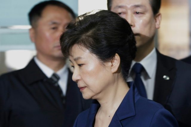 South Korea's ousted president Park Geun-Hye (front) arrives for questioning on her arrest