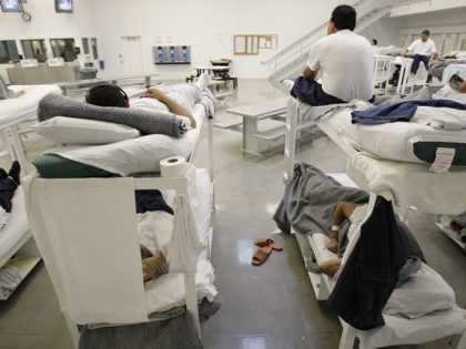 In this photo taken on Friday, Oct. 17, 2008, detainees are shown resting on bunks inside the "B" cell and bunk unit of the Northwest Detention Center in Tacoma, Wash. The facility is operated by The GEO Group Inc. under contract from U.S. Immigrations and Customs Enforcement, and houses people …