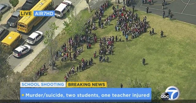 In this frame from video provided by KABC-TV, faculty and students evacuate North Park Sch