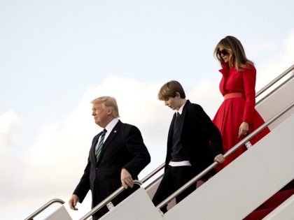 President Donald Trump, with his wife first lady Melania Trump and their son Barron Trump, disembark from Air Force One upon arrival at Palm Beach International Airport in West Palm Beach, Fla., Friday, March 17, 2017. (AP Photo/Manuel Balce Ceneta)