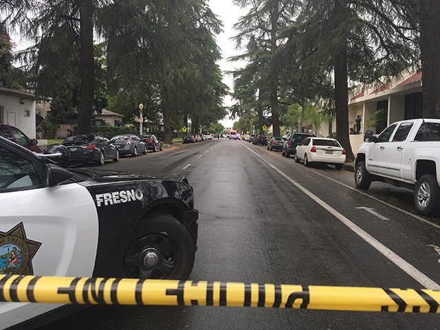 A street is blocked off where emergency officials say a shooting has killed one person and
