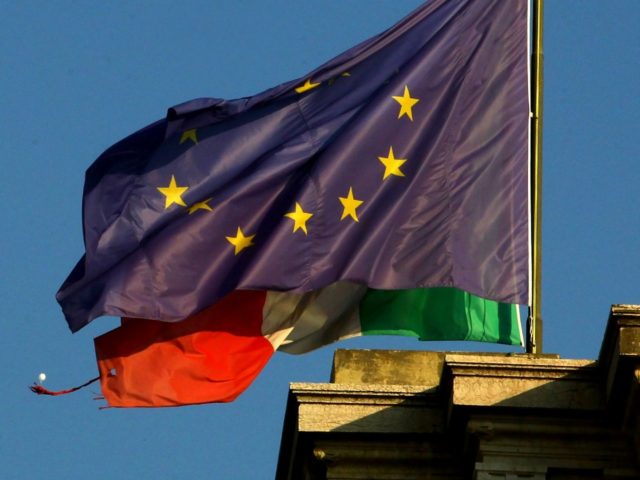 MILAN, ITALY - NOVEMBER 17: The flags of Italy and the European Union are displayed on November 17, 2011 in Milan, Italy. Italy's new Prime Minister Mario Monti unveiled the country's new government yesterday, November 16, as the country steps up efforts to avoid being dragged further into the euro …
