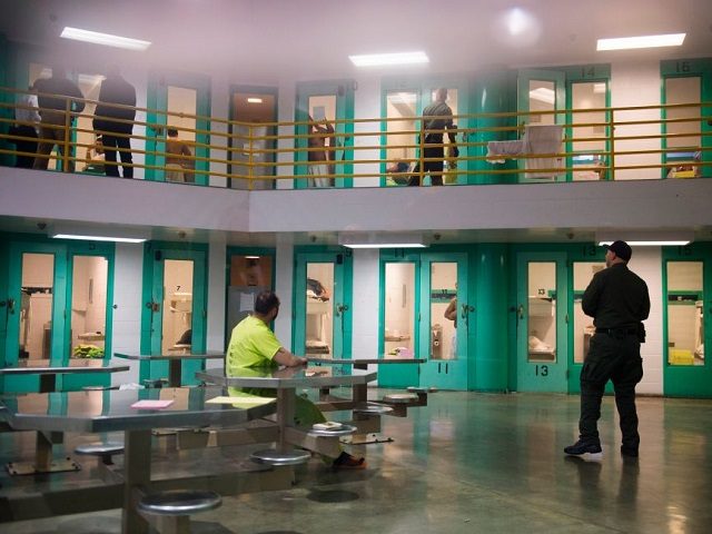 TOPSHOT - A sheriff's deputy (R) talks to an immigration detainee (L) in a high security housing unit at the Theo Lacy Facility, a county jail which also houses immigration detainees arrested by the US Immigration and Customs Enforcement (ICE), March 14, 2017 in Orange, California, about 32 miles (52km) …'s deputy (R) talks to an immigration detainee (L) in a high security housing unit at the Theo Lacy Facility, a county jail which also houses immigration detainees arrested by the US Immigration and Customs Enforcement (ICE), March 14, 2017 in Orange, California, about 32 miles (52km) …