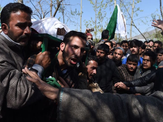 Indian Kashmiri villagers shout pro-independence slogans as they carry a body of a youth Umar Farooq at his funeral in Baroosa, in central Kashmirs Ganderbal district, on April 10, 2017. Eight civilians were killed in Indian-administered Kashmir on April 9 when police opened fire at protesters who stormed polling stations …