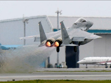 A Japanese Air Self Defense Force F-15 fighter scrambles at the Air Self Defense Force Nah