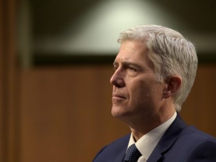 Supreme Court Justice nominee Neil Gorsuch listens as he is asked a question as he testifi