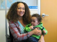 Rachel-Dolezal-March-20-2017-AP HOLD FOR STORY BY NICHOLAS K. GERANIOS MOVING OVERNIGHT FRIDAY - In this March 20, 2017 photo, Rachel Dolezal poses for a photo with her son, Langston, 1, in the bureau of the Associated Press in Spokane, Wash. Dolezal -- who has legally changed her name to Nkechi Amare Diallo …