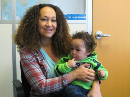 HOLD FOR STORY BY NICHOLAS K. GERANIOS MOVING OVERNIGHT FRIDAY - In this March 20, 2017 photo, Rachel Dolezal poses for a photo with her son, Langston, 1, in the bureau of the Associated Press in Spokane, Wash. Dolezal -- who has legally changed her name to Nkechi Amare Diallo …