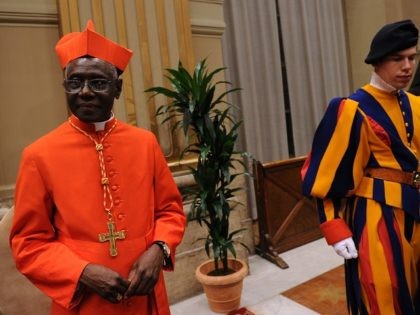 Newly appointed cardinal, Guinean Robert Sarah (L) greets visitors during the traditionnal courtesy visit after the consistory on November 20, 2010 at The Vatican. 24 Roman Catholic prelates joined the Vatican's College of Cardinals, the elite body that advises the pontiff and elects his successor upon his death. AFP PHOTO …