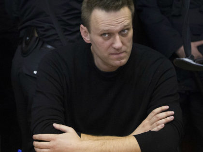 Russian opposition leader Alexei Navalny sits in court in Moscow, Russia, Thursday, March 30, 2017. Many Western countries have condemned the arrests and called for the release of those sentenced to jail, including opposition leader Alexei Navalny, Putin's most prominent foe. (AP Photo/Pavel Golovkin)